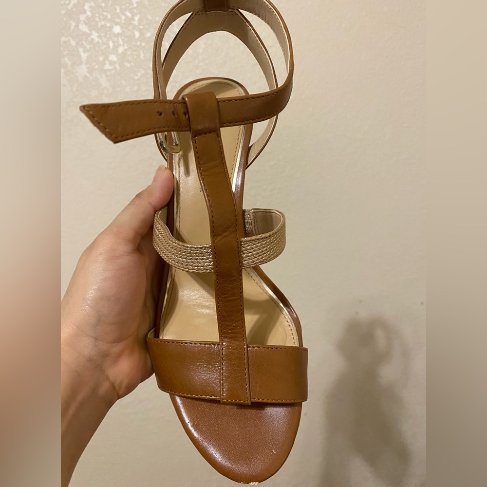 I am selling 8.5 Antonio Melani Shoes in good condition. Brown with gold.